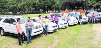 Students with their cars on the Panjab University campus.