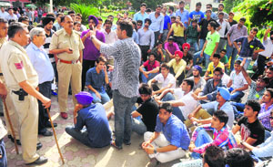 Supporters of SOPU protest at GGDSD College, Sector 32, in Chandigarh on Monday.