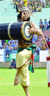 An artiste performs at the opening ceremony of Subroto Cup 2012 in Delhi on Monday.