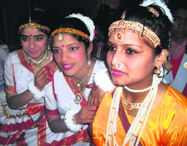 Students of Mussoorie Girls Inter-College wait for their turn during song and dance competition in Mussoorie on Monday.