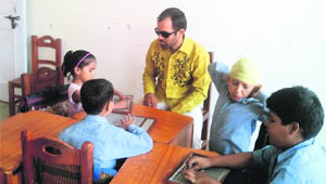  Visually impaired children attend a class at the Helen Keller Institute for Visually Impaired Persons in Sirsa. 