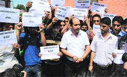 Congress workers hold a protest in Srinagar on Monday. 