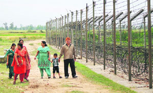 Tourists at the international border in Suchetgarh, Jammu. 