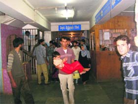 A rush of patients from Manigah village at a Kupwara hospital after they were taken ill. Authorities are trying to ascertain the cause of the mysterious illness