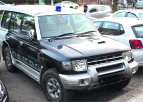 The Pajero with a blue beacon atop