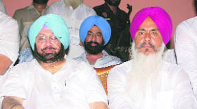 PCC president Capt Amarinder Singh and party leader Harminder Singh Gill (right) at a rally in Tarn Taran.