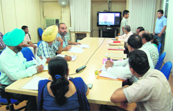 A session through video-conferencing in progress at Suvidha Kendra in Amritsar on Tuesday. photo: Sameer Sehgal