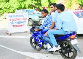 Students give traffic norms the go-by on the PU campus in Chandigarh on Tuesday