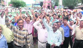 SC/ST employees stage a demonstration in Dehradun on Tuesday