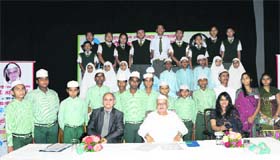 Governor Aziz Qureshi with officials of the State Bank of India and students of various schools who received water purifiers from the bank on the occasion of Teachers Day at Raj Bhavan in Dehradun on Tuesday