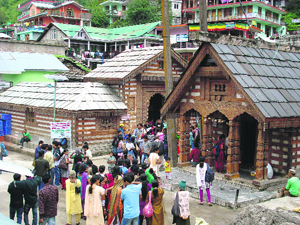 Devotees throng the Vashisht Rishi temple and hot water springs near Manali on the occasion of Bees Bhadon on Tuesday.