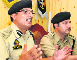 DIG (Traffic) Shafqat Ali Watali along with SP (Traffic) Haseeb-ur-Rehman addresses a press conference at the Traffic headquarters in Srinagar on Tuesday.