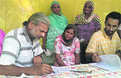 Dr Ashwani Kumar (left) examines patients at Lehra Mohabbat