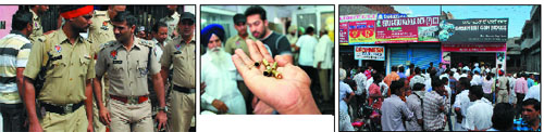 Police at the crime spot: shells of cartridges used in the shootout; a crowd gathers at the gun house near which the incident took place. 