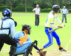 Players take part in a baseball match in Chandigarh on Wednesday. 