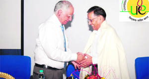 Chancellor of the University of Petroleum and Energy Studies SJ Chopra honours Dr AN Purohit, a former VC of HNB Garhwal University, in Dehradun on Wednesday.