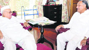 Chief Minister Vijay Bahuguna meets Governor Aziz Qureshi at Raj Bhavan in Dehradun on Wednesday. 