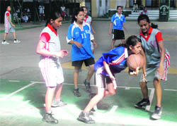 A match in progress in the 8th Gardener Inter School Basketball Tournament for Girls at St. Thomas College in Dehradun on Wednesday. 