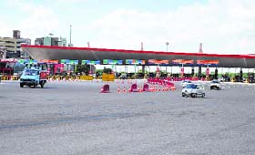 Vehicles move smoothly and swiftly as the traffic congestion, which had become a routine feature at the Delhi-Gurgaon toll plaza, disappeared on Wednesday following the high court orders to remove toll barriers