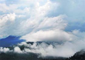 Clouds envelope hills after heavy downpour in Shimla on Wednesday