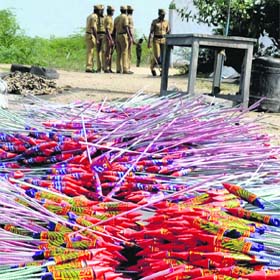 Policemen at the site of the blaze near Sivakasi