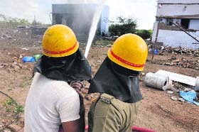 Fire brigade personnel engaged in dousing the flames at a cracker unit on the outskirts of Sivakasi, Tamil Nadu on Wednesday