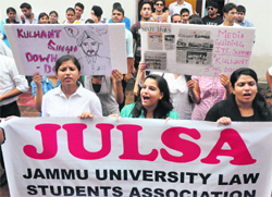 Students protest in support of their demands in front of the VC office in University of Jammu. Tribune photo: Anand Sharma