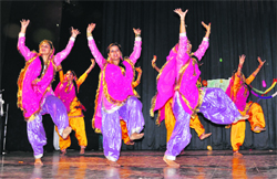 Students perform on stage at the Government College for Women, Gandhi Nagar, in Jammu on Wednesday. Tribune photo: Anand Sharma
