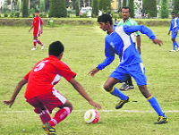 Players in action during a football match in Srinagar on Wednesday. A Tribune Photograph
