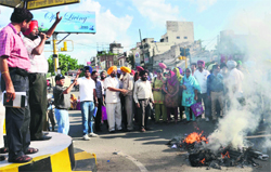 Members of various teacher unions stage a protest against the state government in Ludhiana on Wednesday. Tribune photos: Himanshu Mahajan