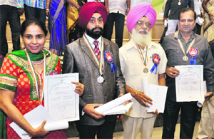 (From L to R) Kuljinder Randhawa, Satinder Singh, Kuldeep Singh Ugani and Roshan Lal with their awards in New Delhi on Wednesday.