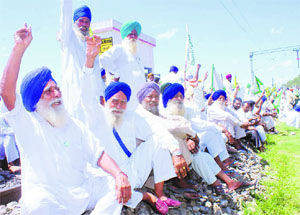 Activists raise slogans against the government at Rajpura on Wednesday