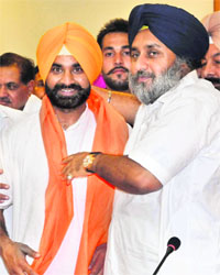 Deputy Chief Minister Sukhbir Badal welcomes Gurpreet Singh of the Peoples Party of Punjab into the SAD fold in Chandigarh on Wednesday
