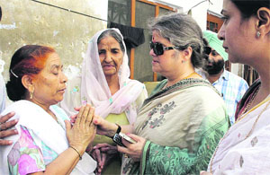 NCW chief Mamata Sharma (right) with Shivalis family members in Jalandhar.