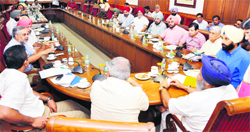 Deputy Chief Minister Sukhbir Singh Badal holds a meeting with representatives of trade and industry from Amritsar on Thursday. A Tribune photograph