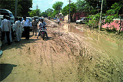 Rainwater accumulated on the road outside the residence of Deputy CM Sukhbir Singh Badal at Badal village in Muktsar district