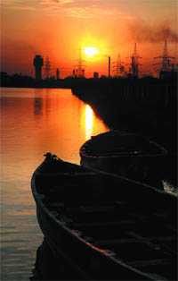 Boats are moored in the Thermal lake as the sun sets on the horizon on Thursday. Though the city has not experienced showers for the last few days, the weather has started turning pleasant with a hint of autumn, spelling relief for the residents. 