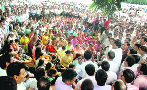 Employees protesting against reservations in promotions hold a meeting at Parade Ground in Dehradun on Thursday.