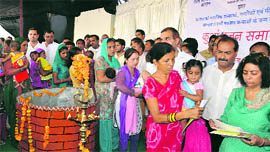 Parents of newborn girls perform kuan pujan in Karnal on Thursday.