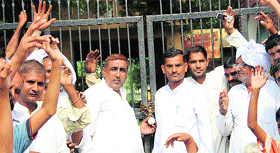 Villagers gather at Government Senior Secondary School, Marodi Jatan, after locking it up on Thursday.