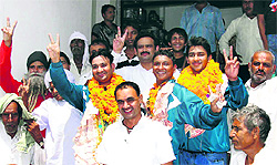 Medal winners Sumit Chhillar and Gaurav Sihag, along with their coach Rajneesh Chaudhary, at Bahadurgarh in Jhajjar