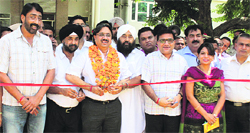 Outgoing Mayor Rakesh Rathour cuts a ribbon for restarting the renovation work at Nehru Garden in Jalandhar on Thursday. Photo: Sarabjit Singh
