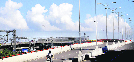 The urban landscape of the Domoria railway overbridge gleams against the backdrop of a glorious blue sky and white clouds in Jalandhar. Photo: Sarabjit Singh