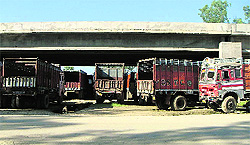 Trucks parked on a road at the Kaddon Chowk underpass in Ludhiana