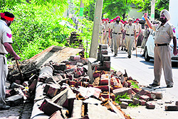 A team of MC officials accompanied by the police razes illegal structures