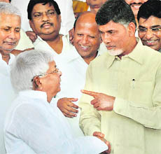 RJD chief Lalu Prasad and TDP chief N Chandrababu Naidu during Parliament session in New Delhi on Thursday. 