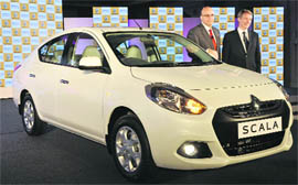 Renault India vice-president (sales & marketing) Len Curran (R) and MD Marc Nassif pose in front of the Scala at its launch in New Delhi on Friday.