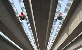 Labourers building a highway to connect Kashgar and Aksu, Xinjiang Uighur Autonomous Region. China gave the green light for 60 infrastructure projects this week as it looks to energise an economy mired in its worst slowdown in three years.