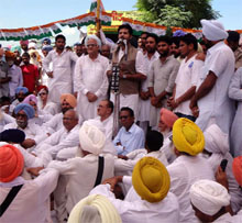 Congress activists stage a protest outside the District Administrative Complex in Muktsar on Friday. 