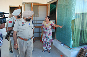 Cops inspecting the site of the shootout. 